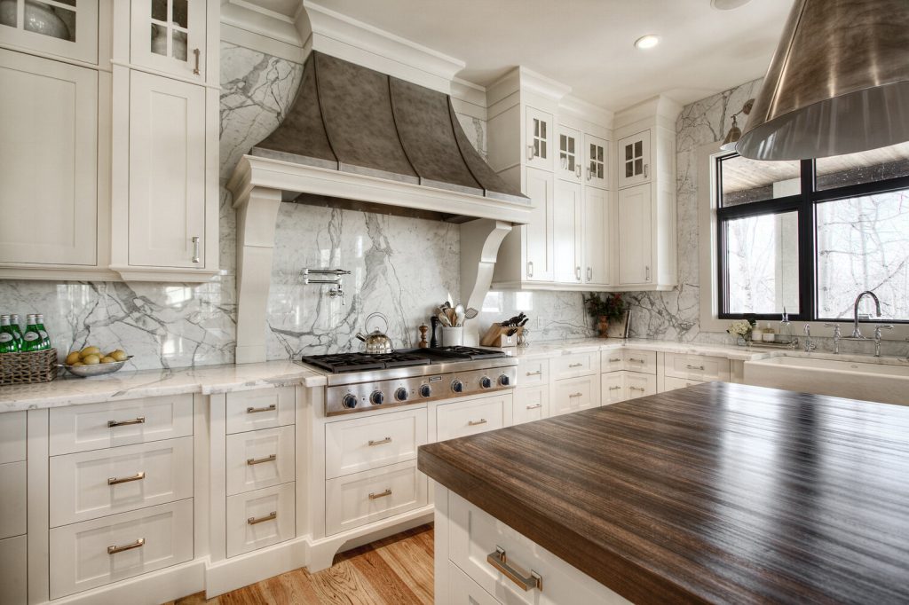 Rustic kitchen backsplash with cabinetry and counter relationship supports Integrating Kitchen Island or Peninsula Seating with Backsplash Flow by showing the room feature the section discusses.