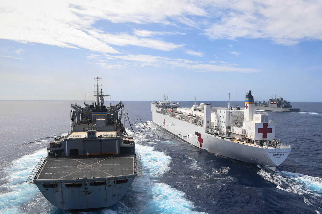 USNS Comfort conducts an underway replenishment with USNS William McLean