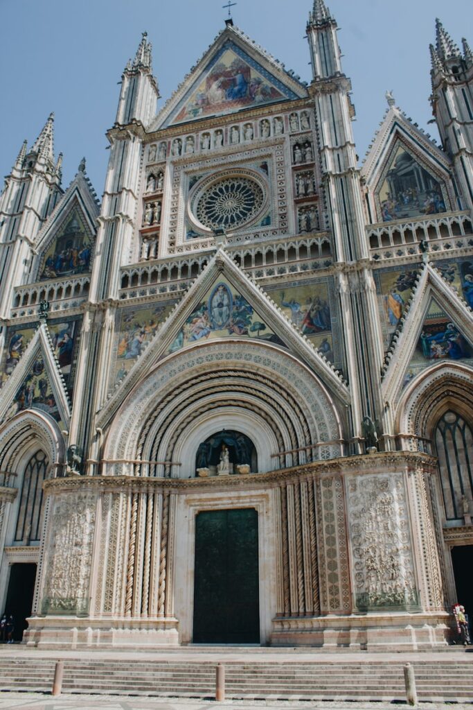 a large cathedral with a clock on the front of it