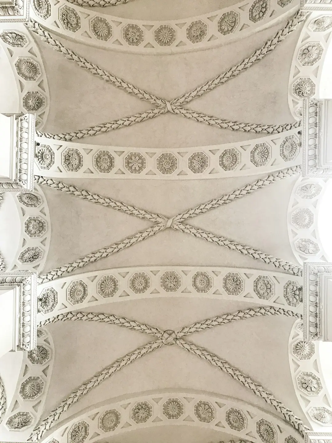 the ceiling of a building with intricate designs