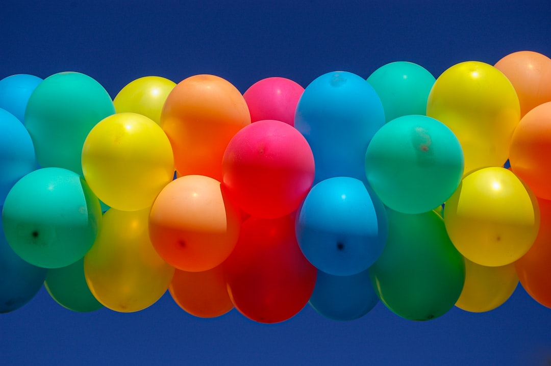 blue pink yellow and green balloons