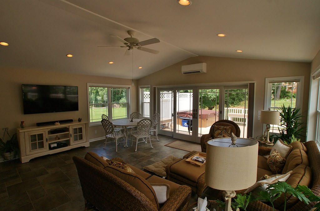 AFTER- The room addition is complete. Hanging from the wall above the sliding glass door is a Mitsubishi ductless split unit that provides heat and air conditioning for the addition.