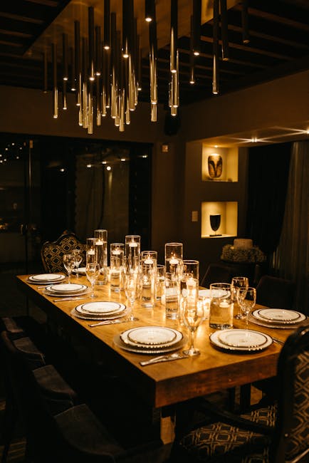 A long table with candles and chandeliers