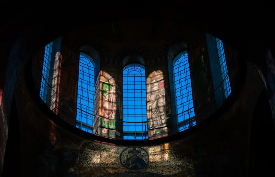 design, community, materials The inside of a church with stained glass windows