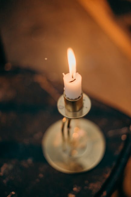 White Candle on Silver Candle Holder