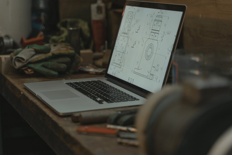 Macbook Pro on Brown Wooden Table