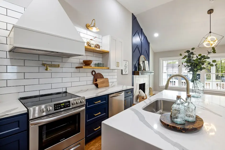Modern kitchen interior with a mirrored glass backsplash that visually expands the space.