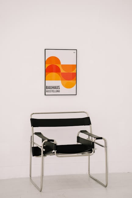 1960s, Designers, Aesthetic Metal Chair Standing in Front of a White Wall