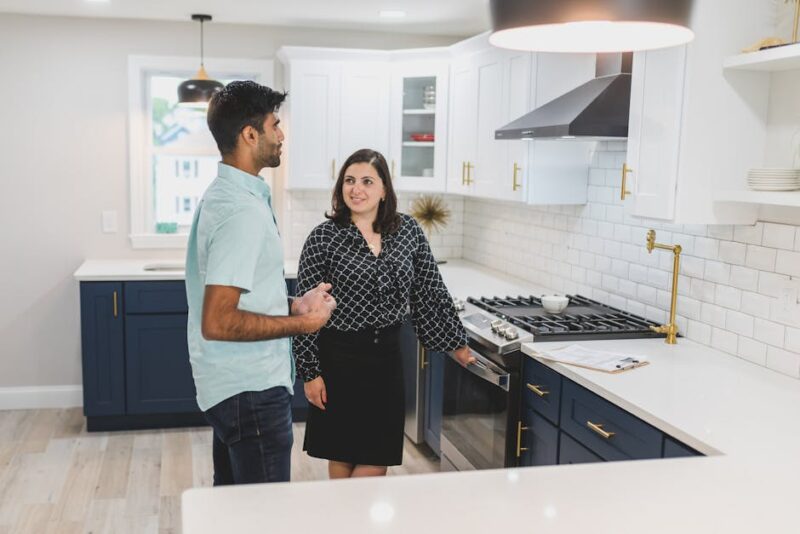 Open Concept Kitchen and Living Room: How to Create the Perfect Flow A Man and a Woman Talking in the Kitchen