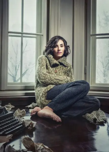 woman sitting near window