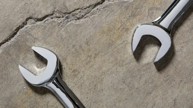 stainless steel tool on gray sand
