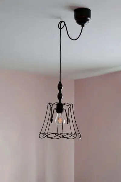 a light hanging from a ceiling in a room