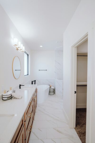 a bathroom with a double sink and a mirror