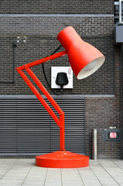 a red lamp sitting on top of a red table