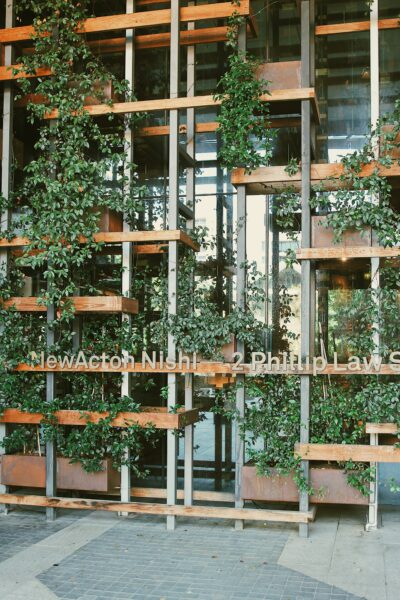 a building with plants growing on the roof