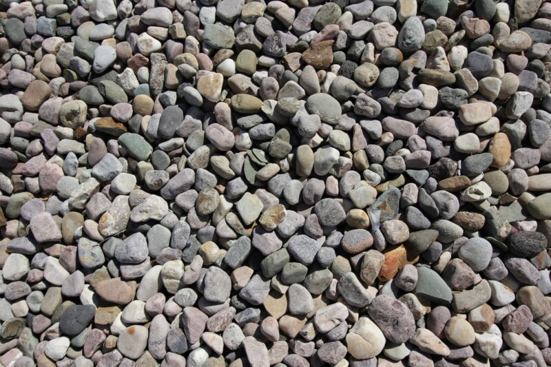 a pile of rocks sitting on top of a sidewalk