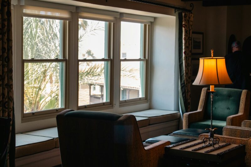 A living room filled with furniture and a lamp