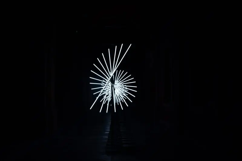 a black and white photo of a fireworks display