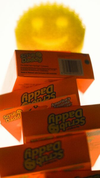 a stack of orange boxes sitting on top of a table