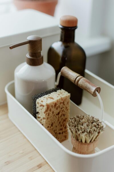 Close-up of elegant kitchen cleaning essentials in a minimalist organizer.