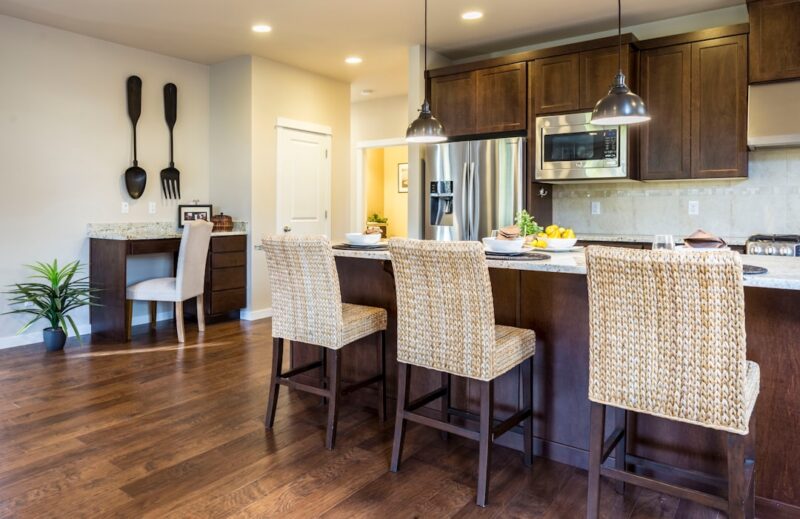 brown kitchen cabinets with white countertops