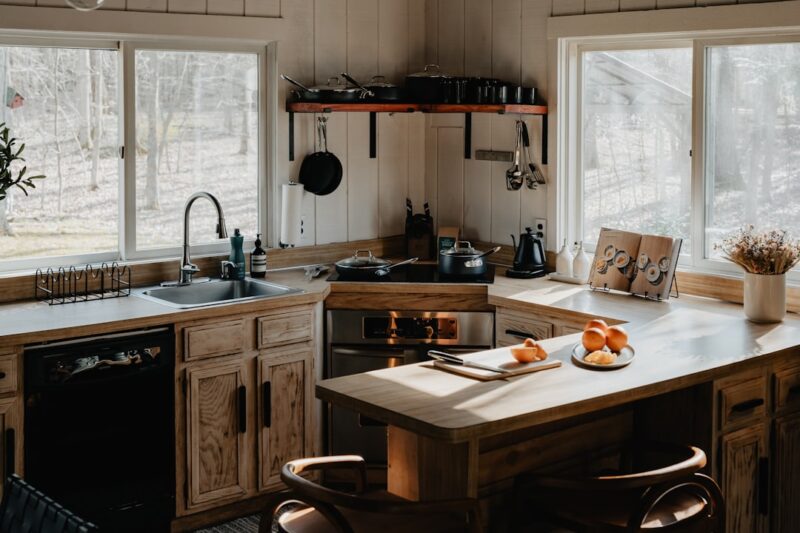 brown kitchen cabinets with white countertops