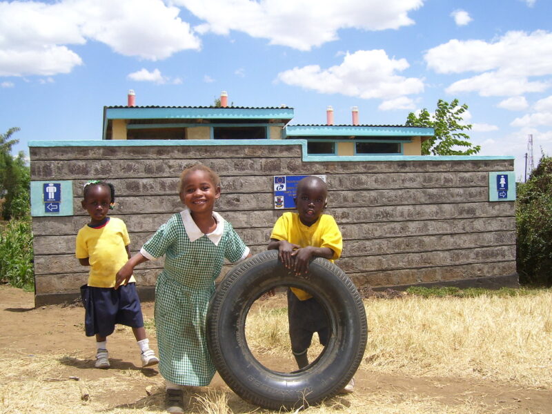 Kids in front of UDDT at nursery house of fire in Nakuru