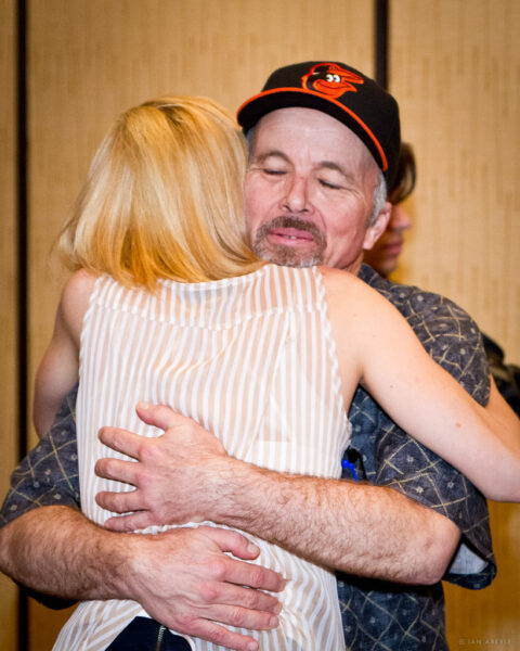 Marie Bollinger and Clint Howard embrace after the Huff screening.