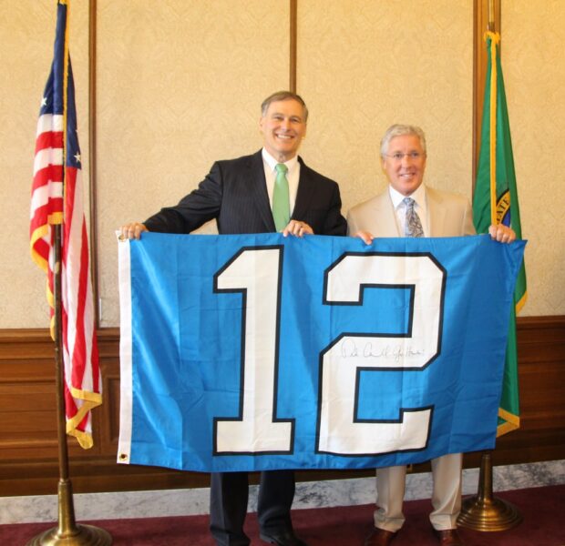 Governor & Pete Carroll show off 12th Man Flag