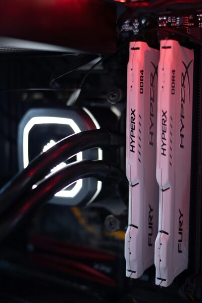 Detailed view of HyperX Fury DDR4 RAM in a gaming PC build with LED lighting.