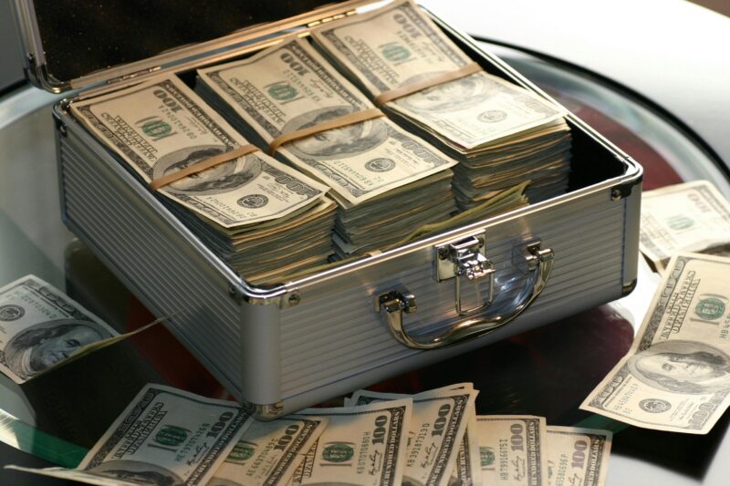 Briefcase of hundred dollar bills, symbolizing net worth wealth