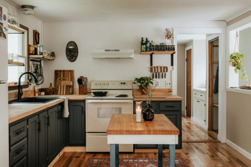 dark grey cabinets with wood countertops