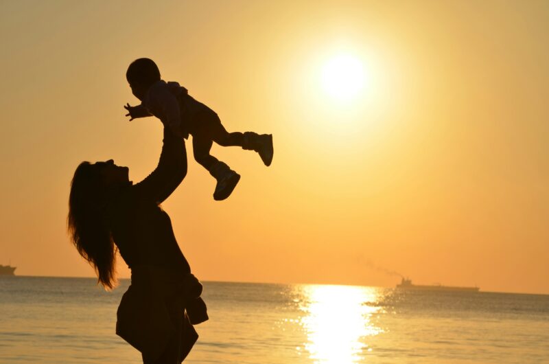 Mother with child at sunset symbolizing where is my mom