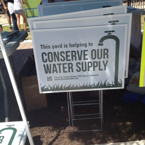 Central Texas Water Efficiency Network gave tips on conserving water. And they gave signs away to put in your front yard.