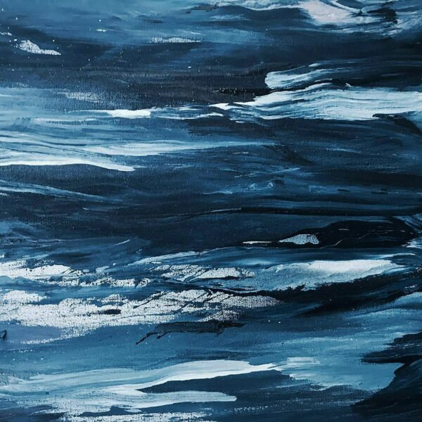Abstract painting with dynamic brush strokes on a wooden deck.