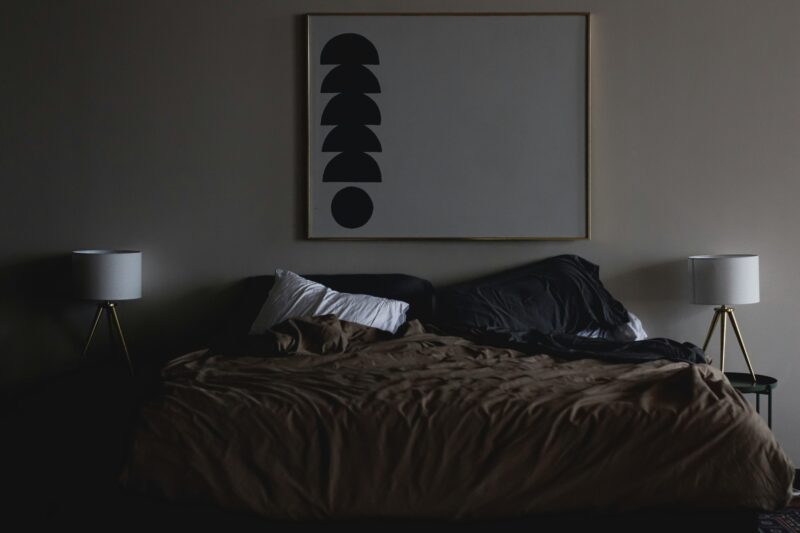 modern bedroom with black accent wall