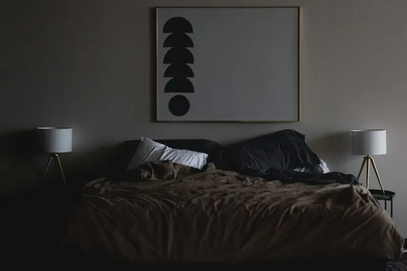 modern bedroom with black accent wall