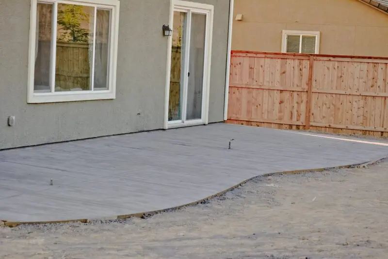 After the concrete pour showcasing a backyard stamped concrete patio.
