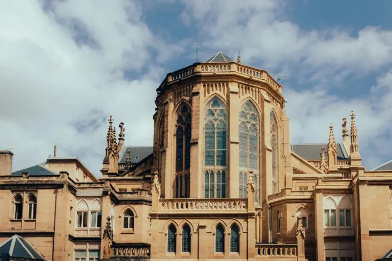 A captivating view of Gothic Revival architecture in San Sebastián, Spain featuring a turret roof.