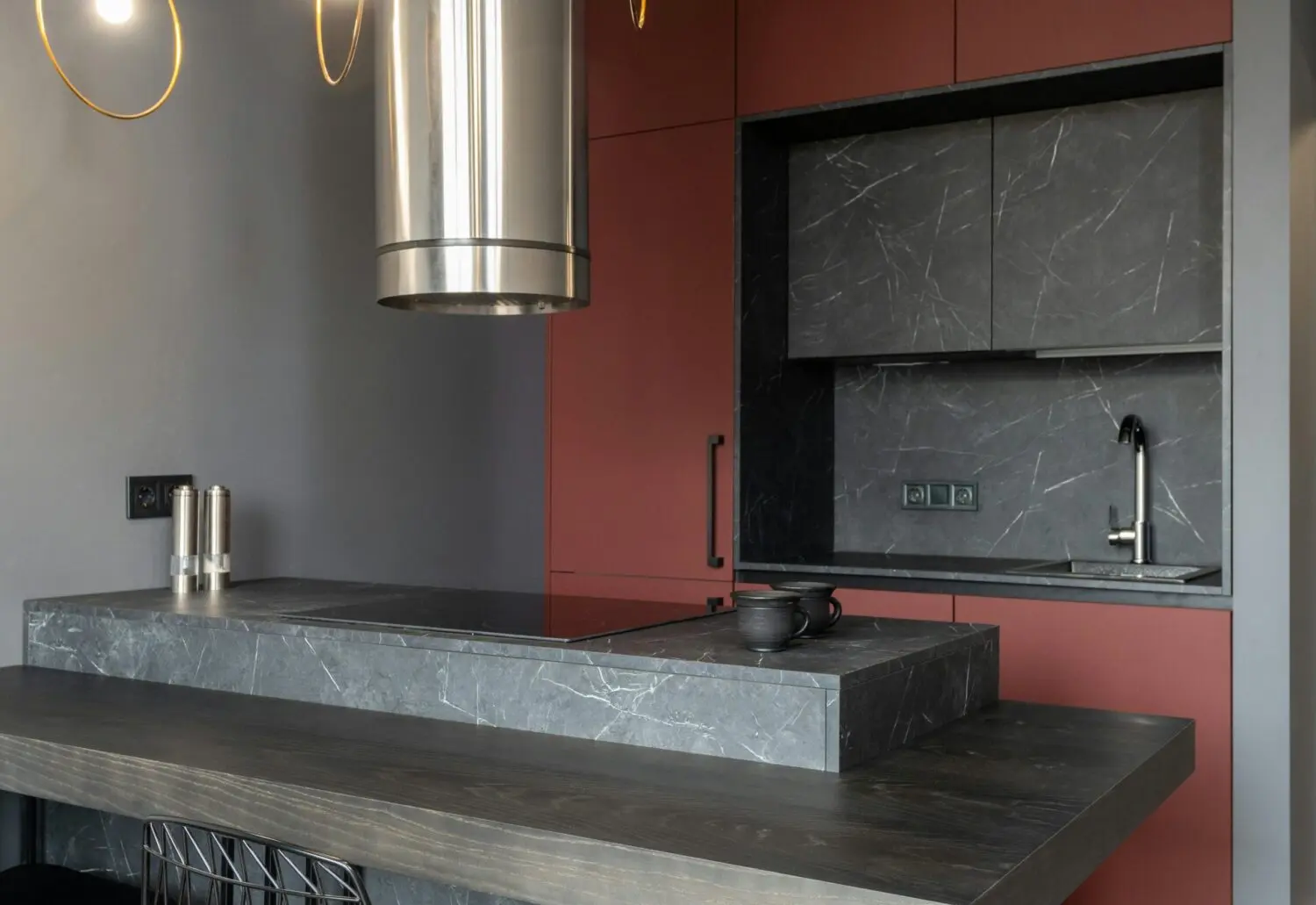Modern kitchen island with cabinets, backsplash area, and vent hood supports Balancing Sink, Range, and Appliance Relationships Across Backsplash Areas by showing the room feature the section discusses.