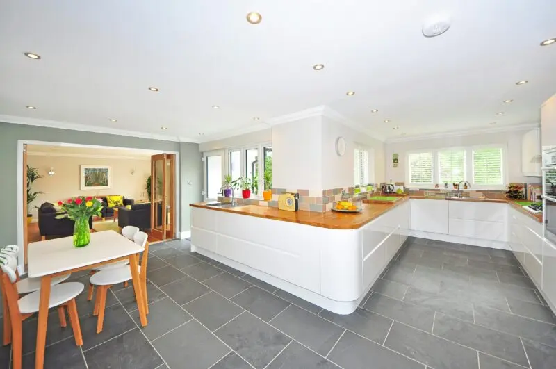 Spacious kitchen dining interior with counters and daylight