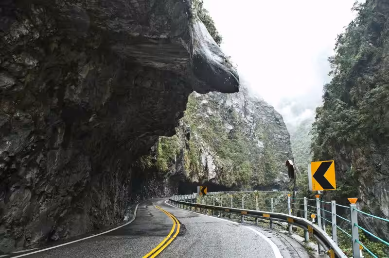 Scenic road through steep cliffs.