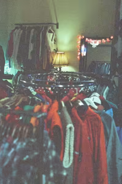 Assorted clothes hanged on rack
