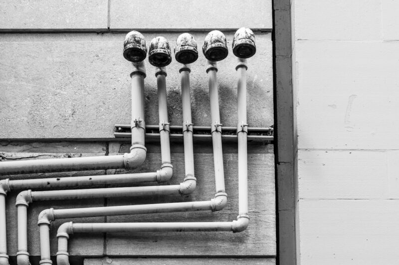 white and black metal pipe