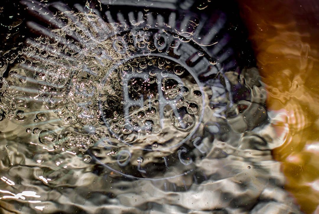 Bubbles forming around a drain in water
