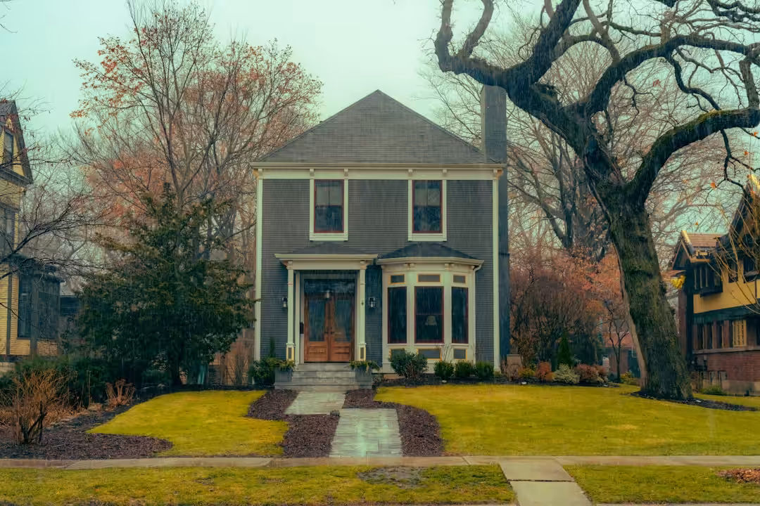 a house with a tree in front of it