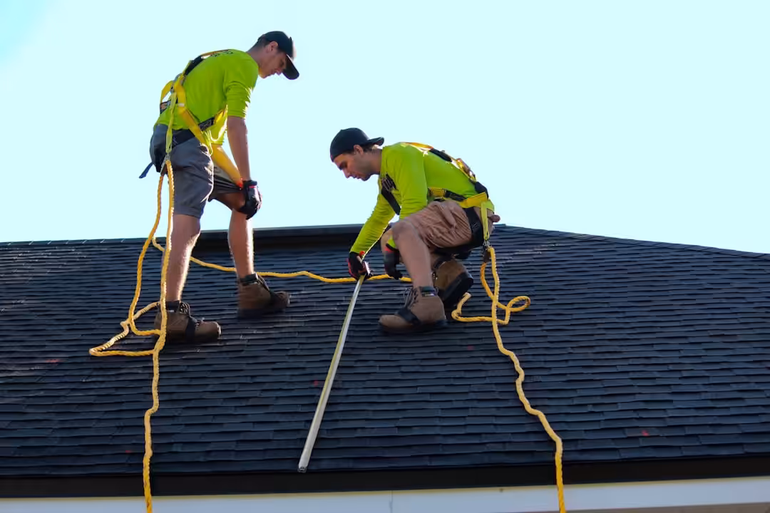 Roof replacement work in progress on a pitched home roof