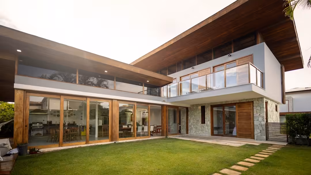Modern house with large windows and a green lawn