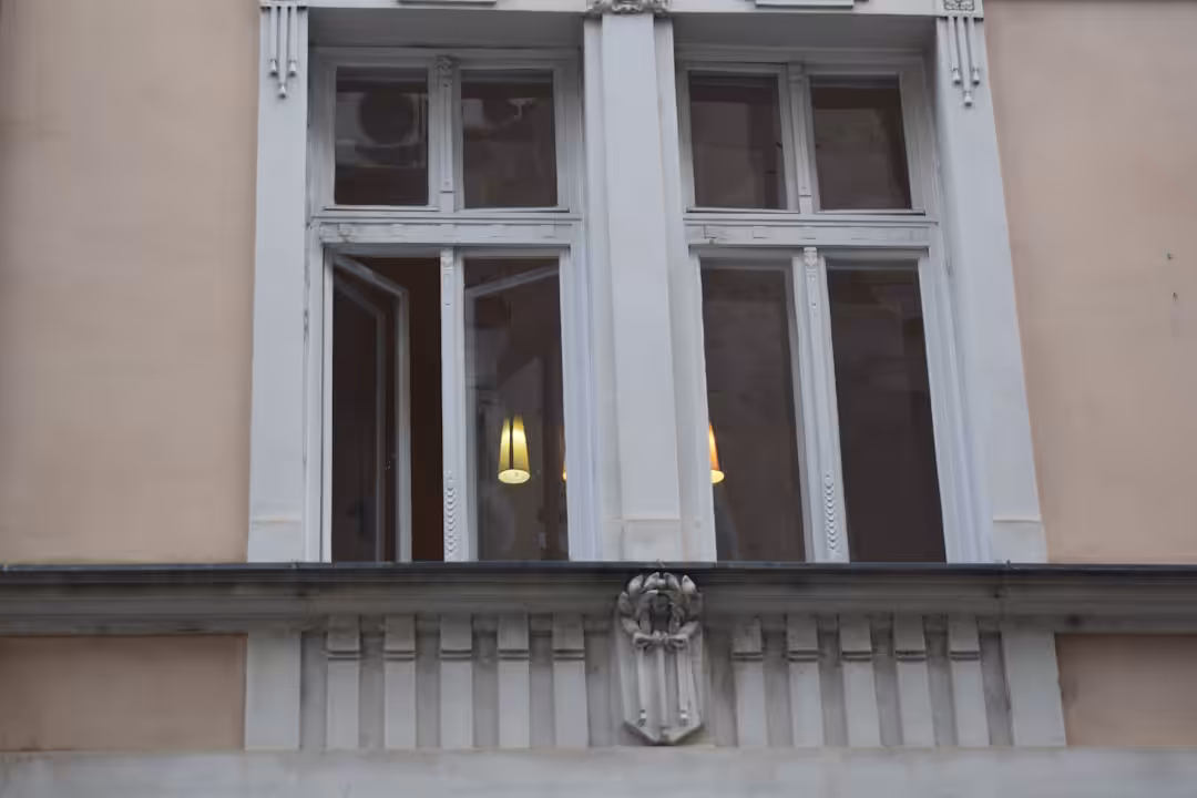A detailed view of a building's ornate window frame.