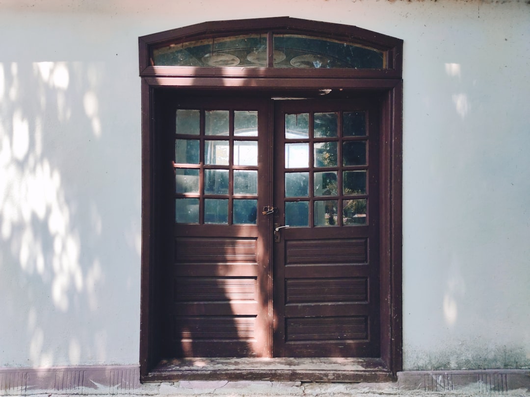 brown wooden window on blue concrete wall